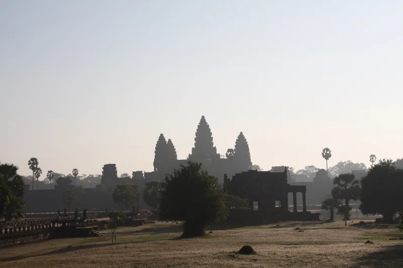 Angkor Wat towers reflected in the north pond before sunrise