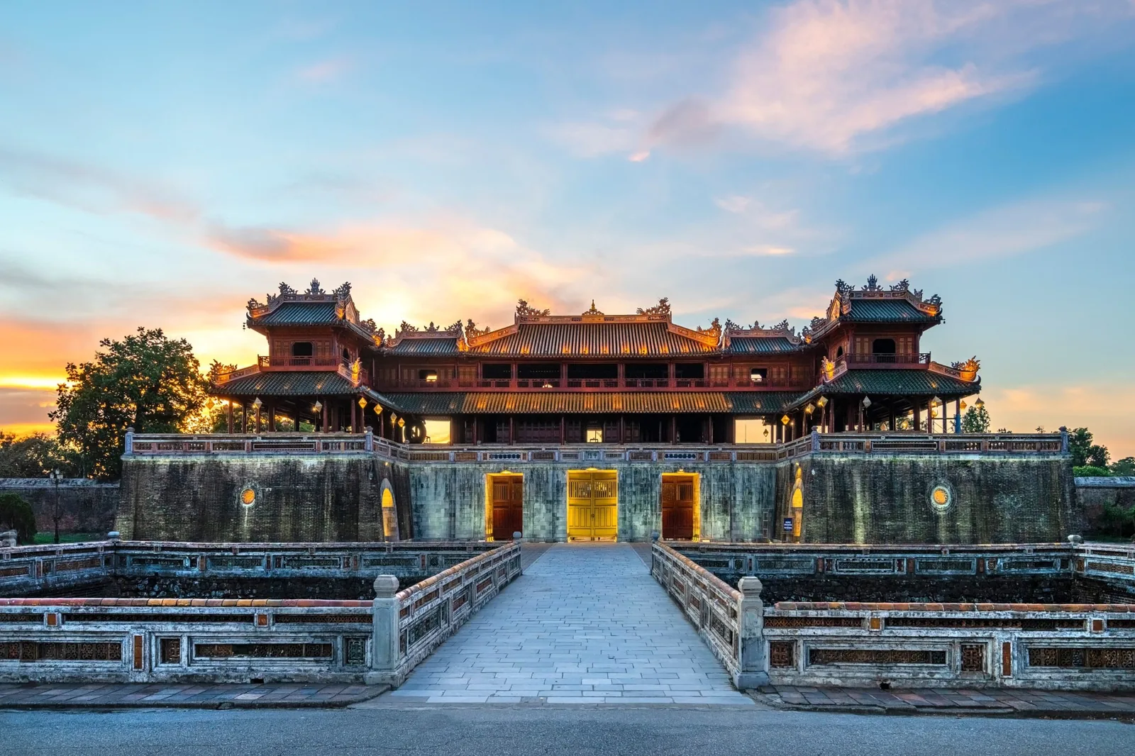 The Meridian Gate of the Hue Imperial Citadel glowing at sunset
