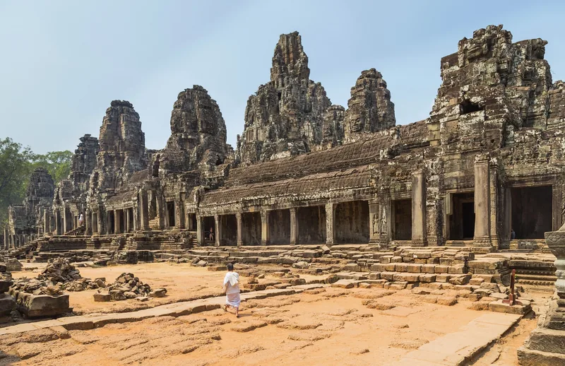 Stone faces of the Bayon temple in Angkor Thom in early light