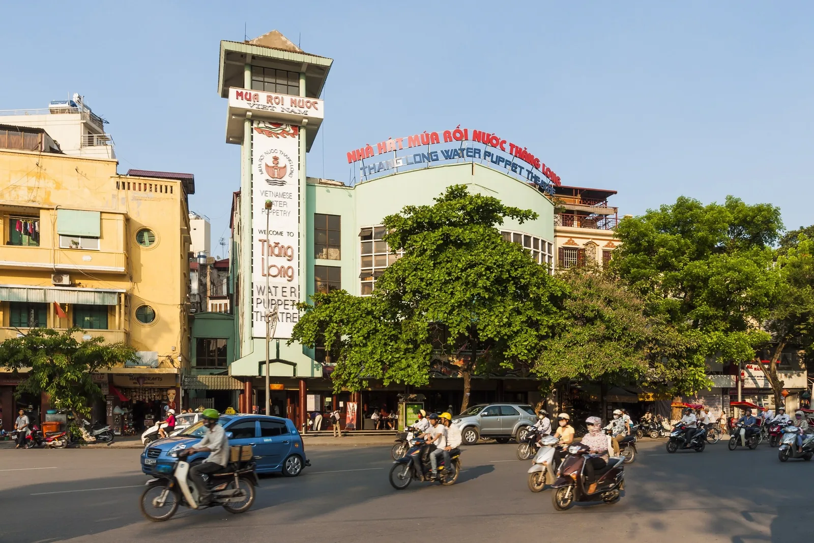 Thang Long Water Puppet Theatre building on a busy street in Hanoi